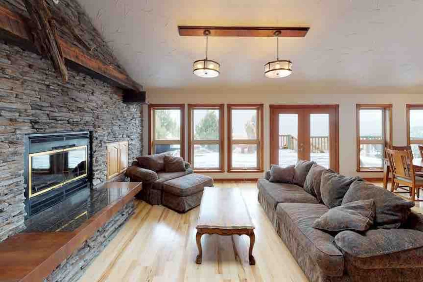 Living room with stone fireplace